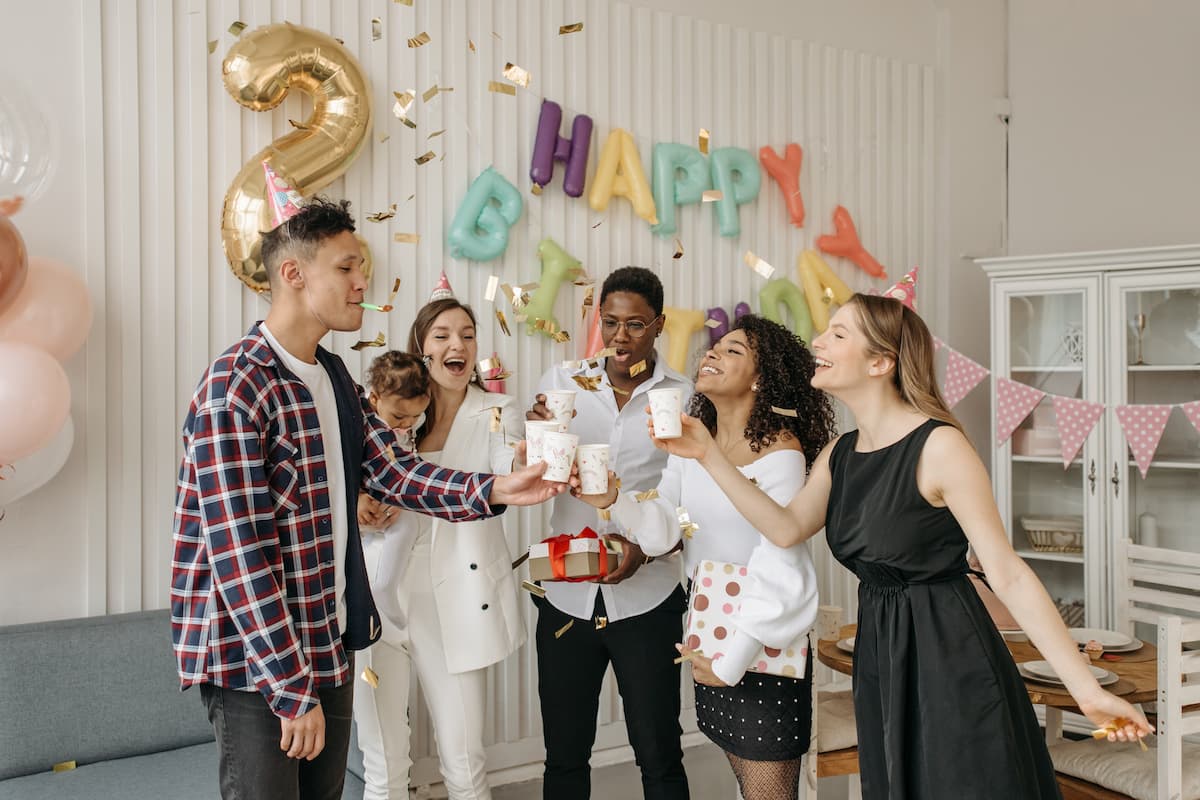 People having a toast during a birthday party. 