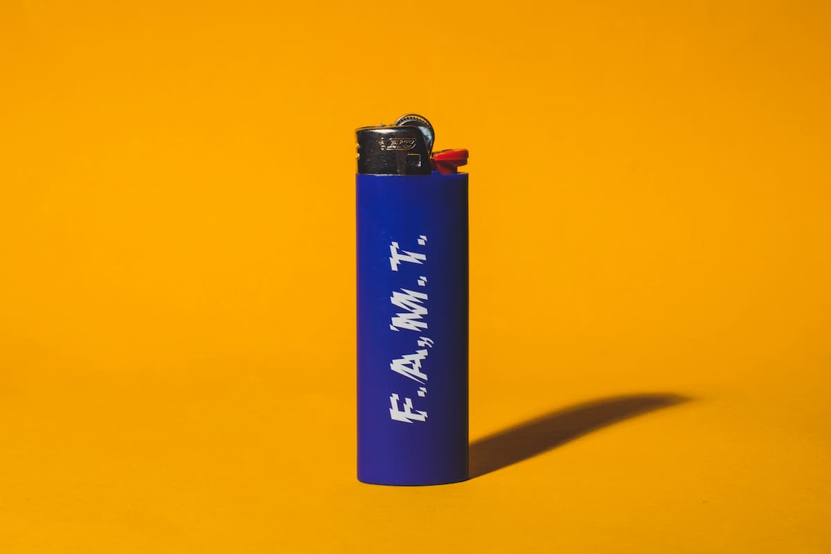 Blue lighter with a yellow background. 