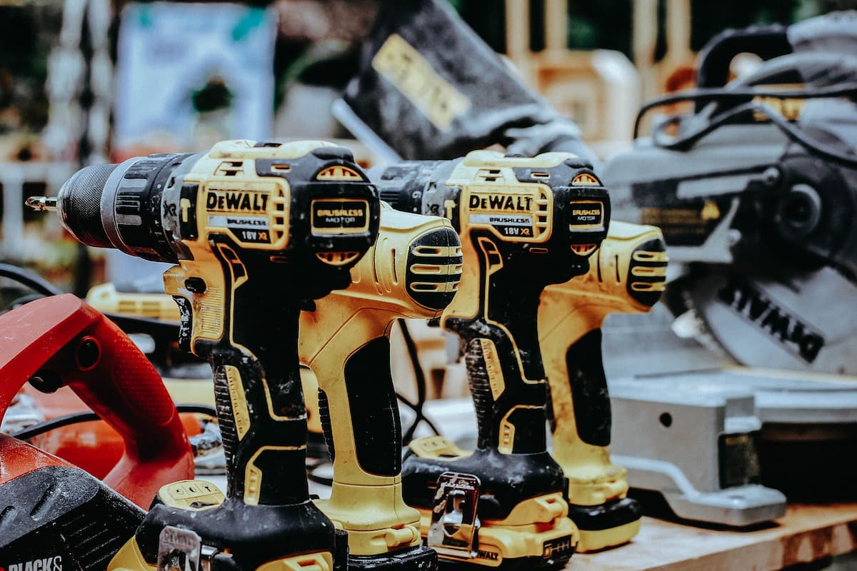 DEWALT® power tools on a wooden surface. 