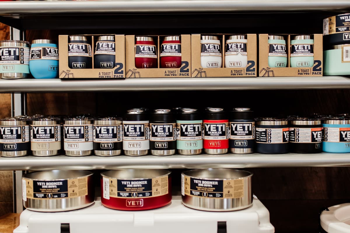 YETI drinkware and dog bowls on a shelf. 