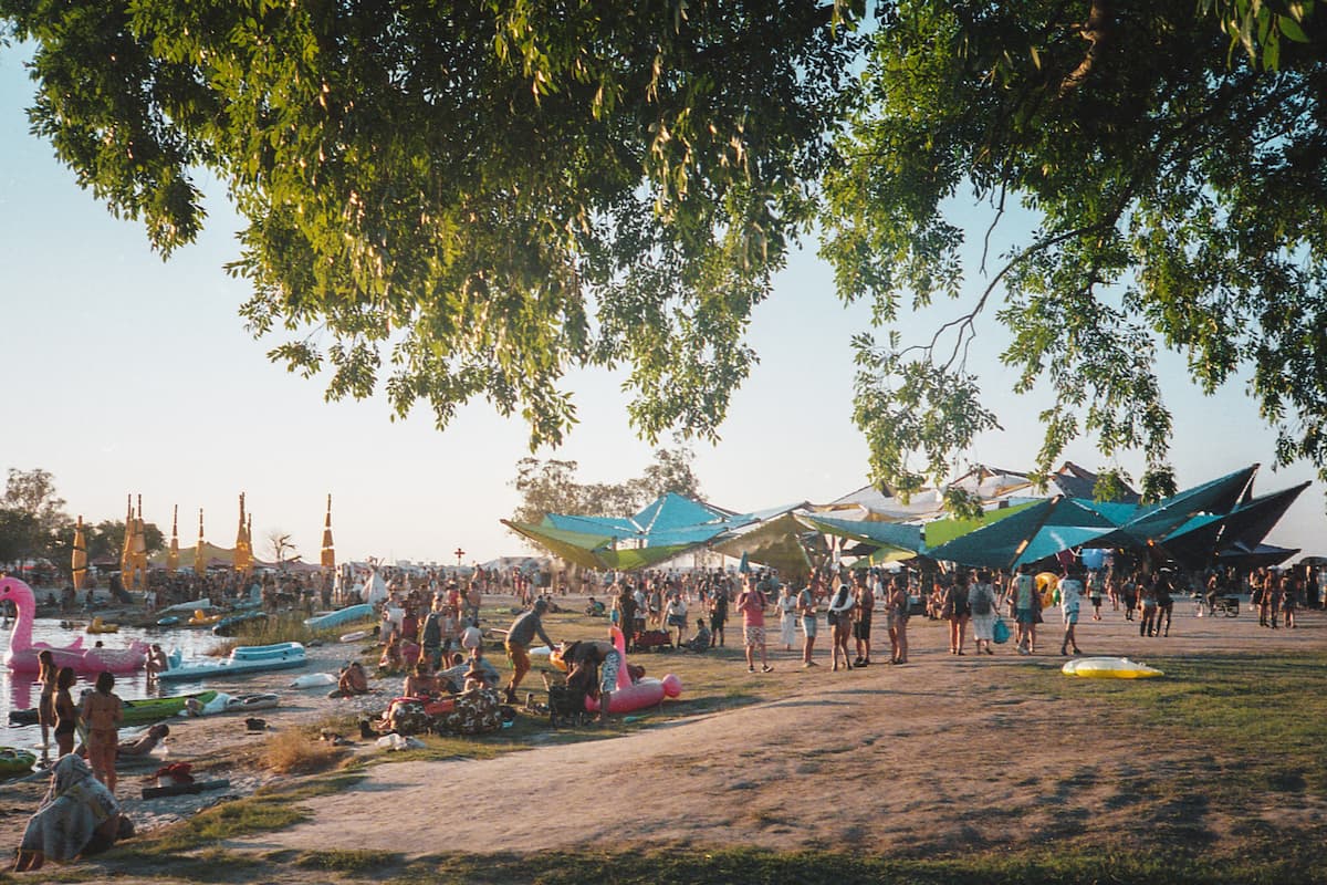 People on the beach during a festival. 