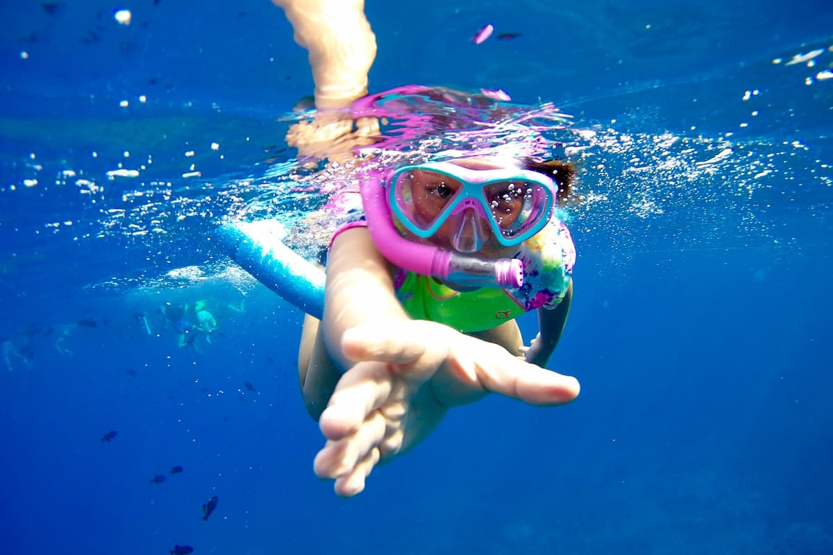 A girl snorkeling.